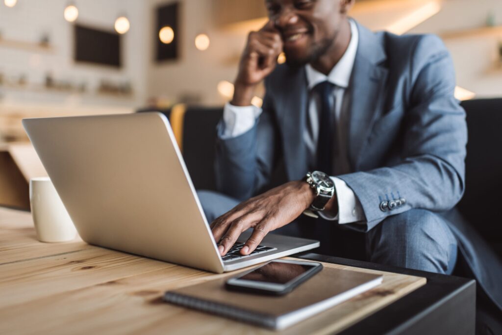 black businessman consultant working on laptop for REDEK IT consultancy